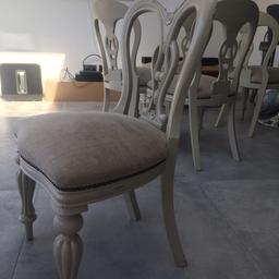 They were painted cream a few years ago and have a distressed look. They could do with being recovered as they were upholstered in a linen coloured fabric so are marked from daily use by the family. They are very well made solid wood chairs so have plenty of life left in them and are very comfortable.

£100 for 5 chairs