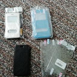 1 iPhone 6 gold flip case with 2 plastic screen protectors with screen dabber
1 iPhone 6 plus turquoise/blue flip case with 2 screen protectors with screen dabber. 
1 black case that could be iPhone 6