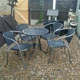 Cast iron table and 4 chairs vgc can deliver if local