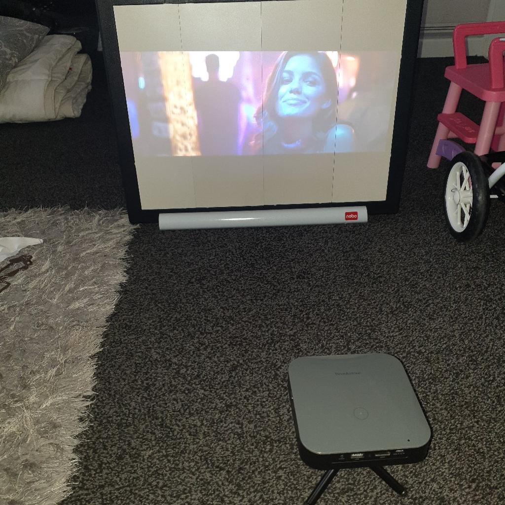 brookstone mini projector and screen in OL8 Oldham for 100.00 for