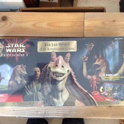 New and sealed
Star Wars Episode 1 "JAR JAR BINKS 3D ADVENTURE GAME. Produced by Milton Bradley in 1999.
Game is brand new and sealed.

Jar Jar Binks and his sidekick - you - are racing home to Otoh Gunga in a 3-D adventure filled with action, danger, and excitement.
Keep an eye on the bumbling Binks every step of the way, for fearsome foes and moving traps lurk everywhere. Race through the swamp and avoid the droid. Wander over the plains and don't let the Kaadu buck you off. Travel underwater