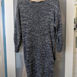 This is a knitted dress from ASOS in a size 12 although it's quite big for a 12. I'd say more 12/14. It has two pockets, popper fastening down the center back, 3/4 length sleeves.