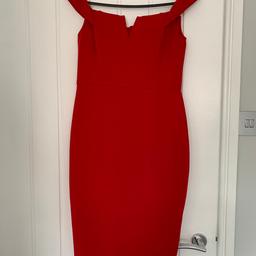Red Off the shoulder AX Paris dress size 10, only worn once. The dress is very comfortable to wear and zips up at the back. Comes from a pet free and smoke free home.