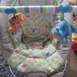 new born baby bouncer, plays songs and vibrates. hardly used. small spot on. other than then perfect condition