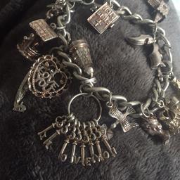 Beautiful silver charm bracelet with lots of charms
