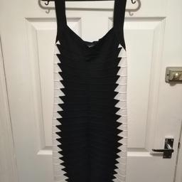 Size 12 bandage dress. Excellent fit and very comfortable, design compliments figure.
postage not included.