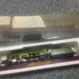 This is a collectible model train from atlas editions. It is a PLM MOUNTAIN CLASS MODEL.it has been kept in the polystyrene and plastic casing, but plastic casing is ,yellowed. 
£6 or £10 for both as selling another one as well 
