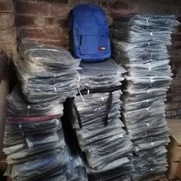 Approximately 245 rucksacks. Black, dark blue, royal blue and 2 red ones.