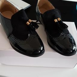 New black shoes with box size 5 uk.bargain.