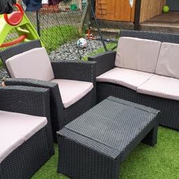 2 seater and 2 single chairs and a coffee table with beige cushions. Bit of damage on table and 2 seater as shown but still fairly good condition. Cushions not part of original set bought new last year. 60.00 o.n.o