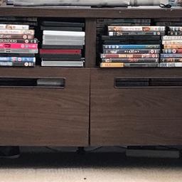 Brown wood effect tv and dvd stand with two drawers.