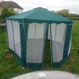 hexagonal party tent cotton gazebo, waterproof, 4 doors, excellent condition.  Approx 13 foot width and 9 foot height.