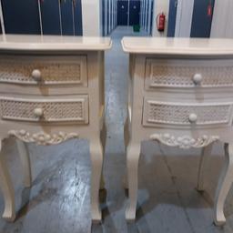 This pair of bedside tables have two drawers and are in good condition.