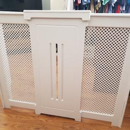 white painted wood and free standing. measurements are 90cm (35 inches) height, 20cm (8 inches) wide and 113cm (44.5 inches) wide. Collection only.