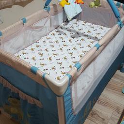 Baby travel cot with bassinet and changing table attachment. The mattress has a henna mark (i touched it by mistake), hence the price.