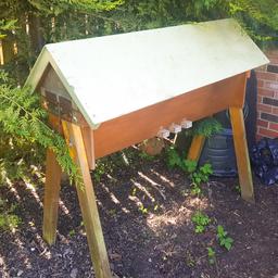 Hinged, wooden and handmade, never got round to using and moving house. just needs the beginner cells and bees adding.

inside is immaculate, outside needs a lick of varnish.