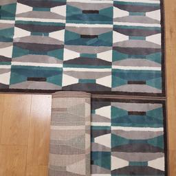 ** 1 left **
1 lightly worn (almost new looking) rugs.
low pile
blue turquoise grey geometric pattern
smoke free and pet free home
170 cm x 240 cm each