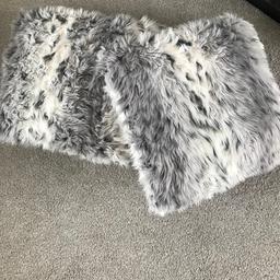 2 faux fur cushions white, grey and black. 
Excellent conditions.