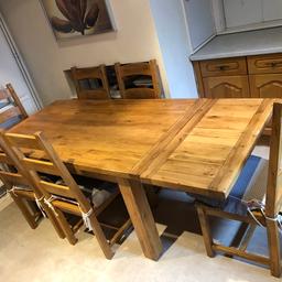 Wooden Dining table and chairs (6), good condition, covers not included. Only selling due to house extension. Table extends both ends. Table is heavy, can help load or deliver to the door for a fee. 

Size (approx) W - 1675mm D- 915mm 

Extends (approx) to a W- 2575mm  

07587031173 Read less