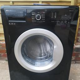 Beko washing machine in black 6kg slimline model ideal for a flat in good working order with a few cosmetic marks a 1400 spin and short wash program thanks for looking