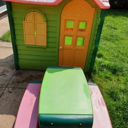 Little Tiles Country Cottage Playhouse evergreen, with a sink, a cooking hob and a phone.
Matching Little Tiles picnic table with 2 benches