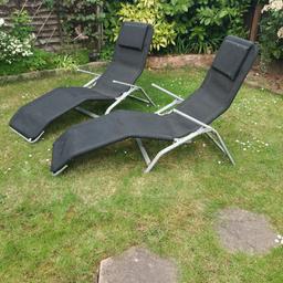2 black sunloungers, used, a bit dusty and rusty but plenty of life in them.