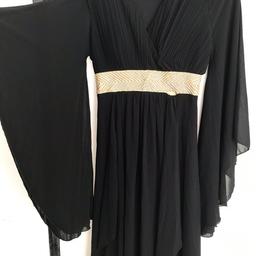 Black kind dress 
Long sleeves 
Tag says size m/l but would fit up to a size 20 because it has a stretchy back 
Gold diamond decoration 
A slight rip but will be perfect with a few stitches 

Collection roehampton 

Open to offers 

Please check out my other items a lot more dresses and other. 😁