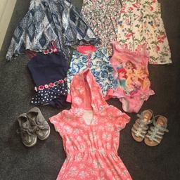 Great holiday bundle. Includes 2 swim suits, swim jacket, towel dress, 3 pretty dresses and shoes (size 10) and sandles (size 10). Good condition.