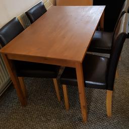 Wooden table, and 5 faux leather chairs, would suit someone starting out