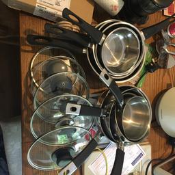 2 sets of saucepans various sizes with some lids used but in good condition