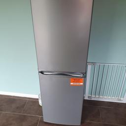 fridge freezer 2 months old, house move forces sale, it has 10 year guarantee , silver in colour, offers welcome (reasonable), located in STAFFORD,