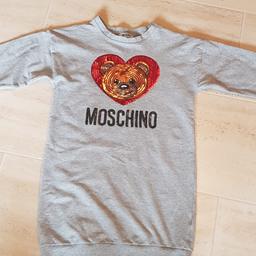 Moschino girls jumper dress in immaculate.?worn twice. I can post £5. PayPal or bank transfer