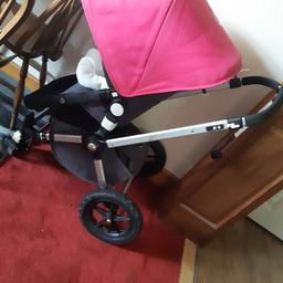 good condition bugaboo.
comes with:
main seat
carry cot
raincover
pink hood and apron for carry cot
blue hood, apron and seat liner
orange hood, apron and liner.

I've payed £50 for each colour pack. I brought the pink with the pram.
so it's a bargain.
the handle looks and moves like is lose but no is nothing wrong with it. each bugaboo pram got this.
also the chassis been wrapped in vinyl (black matt)