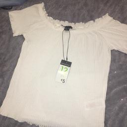 Never been worn - all tags and labels are still on. In perfect condition. Size 12 however is smaller than standard uk 12 therefore will fit size 8/10. Frilled detailing shown in pic.