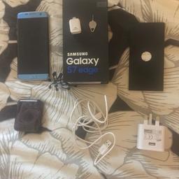 Samsung Galaxy S7 Edge 32GB. Comes with phone, charger plug and cable, USB connector, sim adapter, headphones, box and instructions. Good condition - some minor scratches, see pictures. Used for a week - almost brand new (headphones never used)