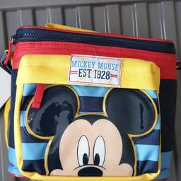 BRAND NEW still has tags on. 
Kids Mickey Mouse Pack lunch bag. 
Never used. 
Insultated from the inside. 
Zip fastening. 
Zipped outer pocket for small handy stuff. 
Strap to put over shoulder. 
Purchased from Disney store (£10.99)