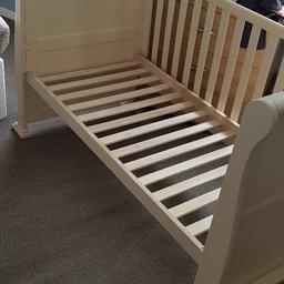 cream wooden sleigh bed for sale, we have been using this for our 2 year old its without mattress and without both the sides as we didnt need them for her , in good condition