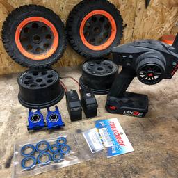 2sets of wheels (need 2 tyres for 1 set )
2rear blue alloy wheel hubs
1steering servo 1/5 scale
1 throttle servo 1/5 scale
1set wheel bearings still in the packet
And a dx2 transmitter

In Hatfield Peverel essex