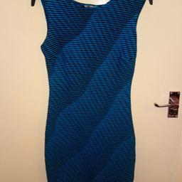 Never worn
Stretch but not bodycom - thicker quality fabric
Blue Black pattern
Post £2.90