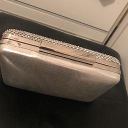 Silver clutch bag
Very stylish
Only been used once 
Will accept offers