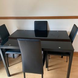 Black glass table and 4 chairs, used but in good condition. Collection only.