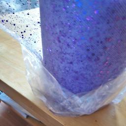 LIlac glitter tulle roll, nearly 100 yards.please note glitter does come off.