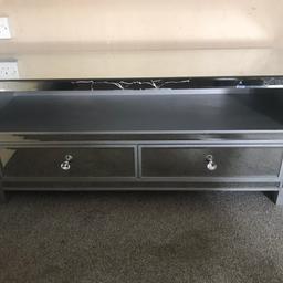 Mirrored TV Stand for TVs up to 43inch
Good condition although cracked front as you can see in photos

Brought for £300