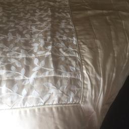 Cream throw over. Would fit double and king size bed