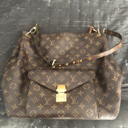 Louis Vuitton Metis. Comes with dust bag and the receipt. Purchased in 2013. Good used condition.