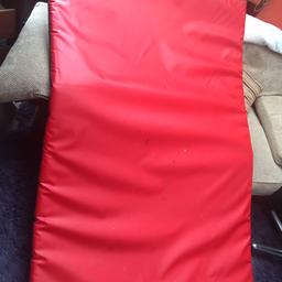Red gym mat it has madding inside perfect for gymnastics or yoga or young children to play on