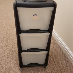plastic, very good condition, H67xW28xD39cm, black finish with clear drawers and wheels for mobility. Ideal for corners and empty spaces. perfect for storing bathroom essentials