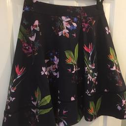 Beautiful Ted Baker London navy midi length skirt PLIO with a beautiful tropic pattern. Very nice condition no stains etc. Ted Baker size 2 - equivalent to UK size 10. Will post or collection free in person in Peterborough