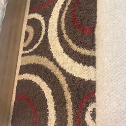 Brown cream and red rug....in good condition!

150cm by 30cm