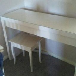 Glass topped dressing table from ikea. Very good condition, no marks or damage. Drawer has lining.  Stool also from ikea